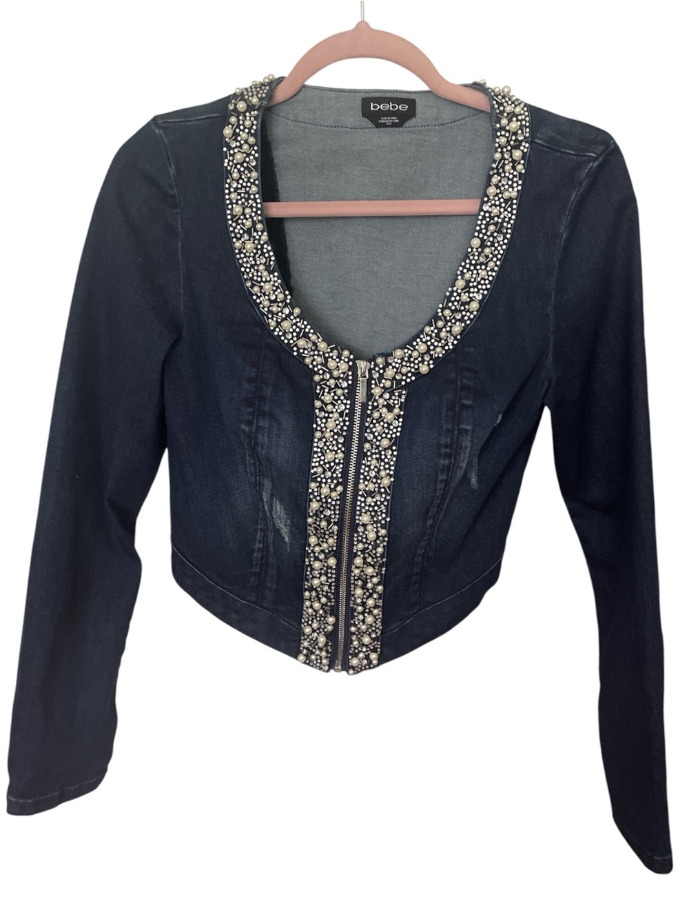BEBE CROPPED STRETCH JEAN JACKET WITH FAUX PEARL DETAILS